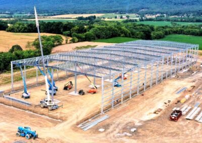 Aerial view of a large industrial construction site in a rural area with ongoing work